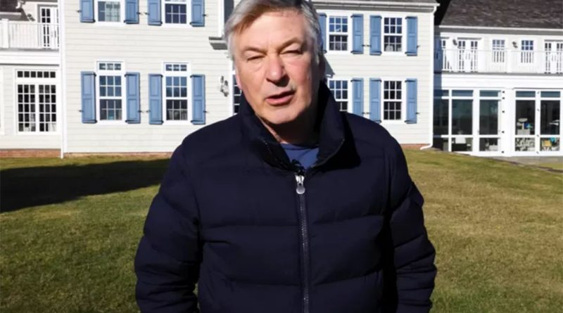 Image of Alec Baldwin stood outside his large home to support celebrity home article