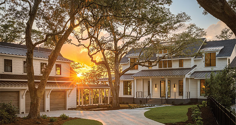 Home exterior surrounded by trees during golden hour