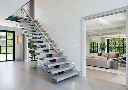 Open plan staircase in a white hallway