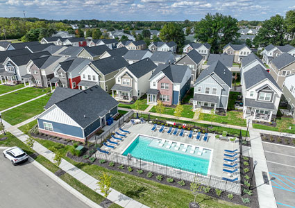 Apartments next to a pool with loungers