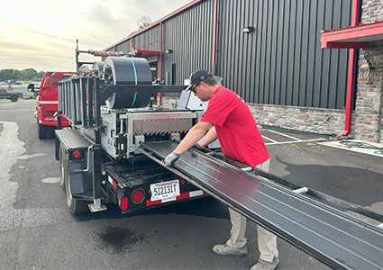 Loading metal cladding onto a trailer