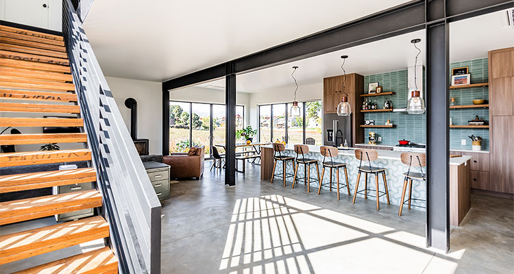 Open plan living space with wood & metal staircase