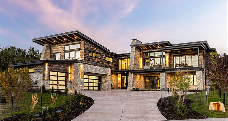 modern home with a stone and wood facade