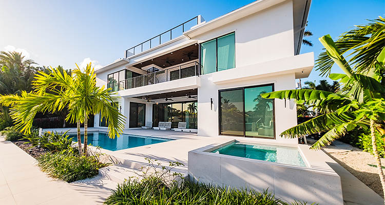 Celebrating its 60th anniversary, Snellman Construction continues to prove the power of passion in homebuilding excellence a modern luxury home with a swimming pool and spa