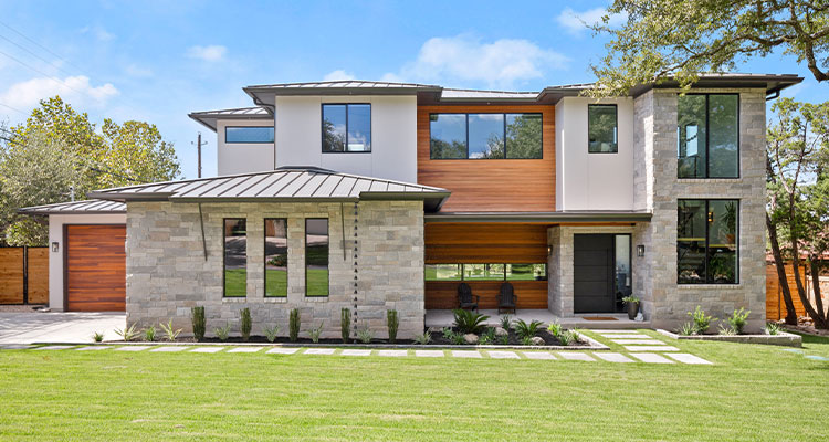 How Dumbeck Custom Homes’ strong relationships drive success a modern, two-story house with a distinctive architectural style, likely a contemporary or modern farmhouse design