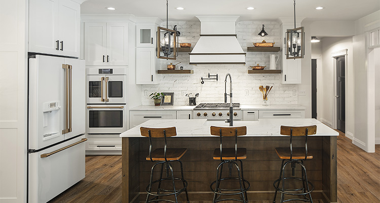The bridge between design and reality in modern kitchen aesthetics Exquisite custom cabinetry is the hallmark of this kitchen design from Covered Bridge Cabinetry
