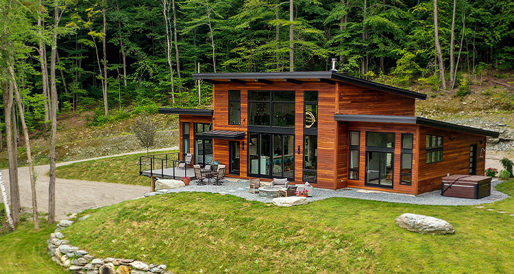 Yankee Barn Homes pioneers panelized construction for sustainable custom homes a modern post and beam house known as the "Hill House" by Yankee Barn Homes.