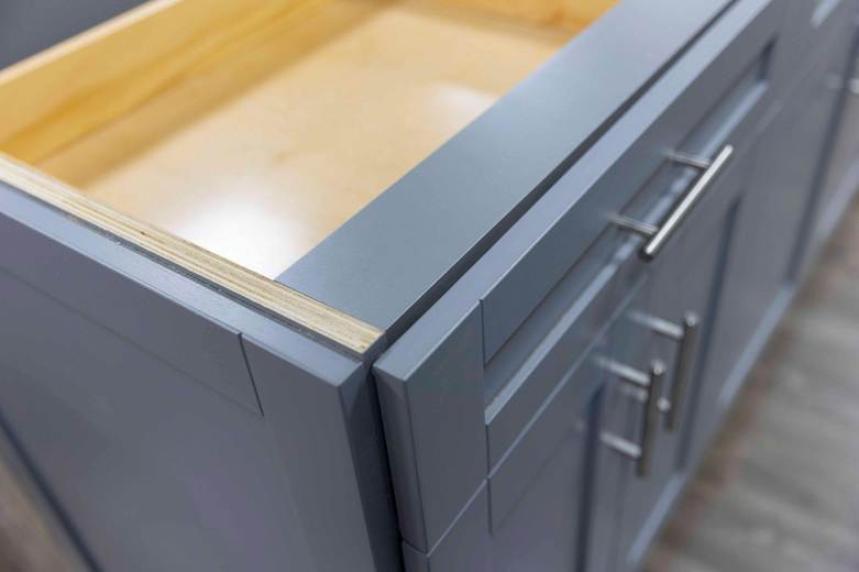 Blue/gray kitchen cabinet by PKB Cabinetry