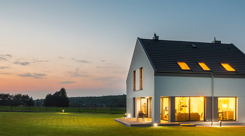 modern luxury home exterior at dusk with large windows, open plan interior lighting, minimalist architecture and landscaped garden