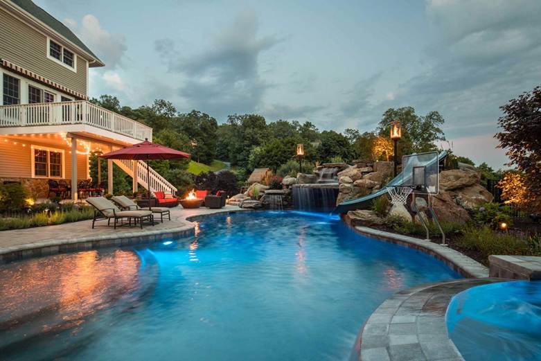 Freeform Pool with Ambient Lighting by Neave Outdoor.