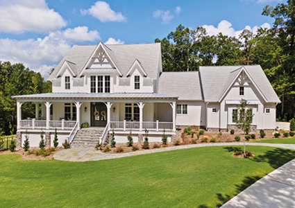 a contemporary farmhouse design characterized by a prominent wrap-around porch and efficient attic space.