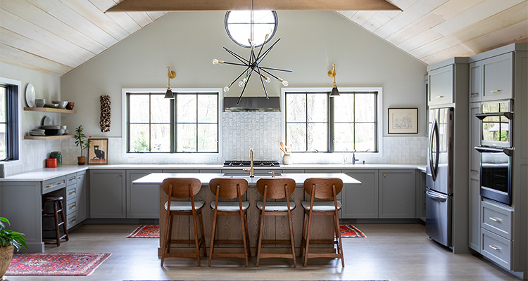 a modern kitchen design showcasing grey shaker-style cabinets and a central island with seating