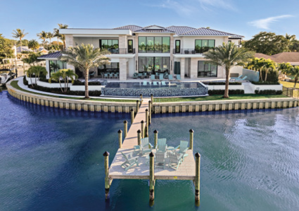 a modern, multi-story luxury waterfront estate in Florida