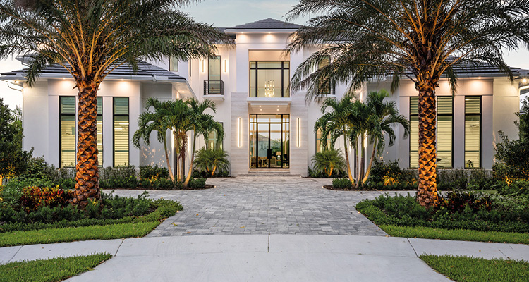 a luxurious, modern Mediterranean-style villa at dusk.