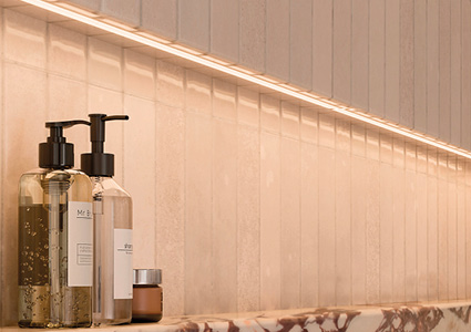 a modern bathroom scene highlighting Kichler Lighting's 6t COB Wet Tape Light