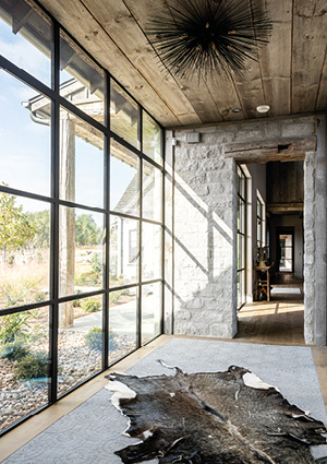 a modern farmhouse interior designed by Mabery Contracting in Texas Hill Country.
It showcases a blend of rustic charm and refined craftsmanship.
The space includes large steel-framed windows and a stone wall.
A cowhide rug sits on the floor beneath a unique starburst light fixture.
Where luxury meets Hill Country charm PC - Instagram
6 Feb 2026 — 33 likes, 1 comments - maberycontracting на February 6, 2026: "Where luxury meets Hill Country charm ✨ PC: @danielleloch...instagram.comDouble ovens, double faucets, and no detail overlooked ‍ PC
21 Apr 2026 — Rustic and refined, this stunning bedroom is proof that farmhouse charm never goes out of style 🖤🤍 PC: @daniellelochtep...instagram.comHouse built into a rock in San Juan Island - Facebook
17 Dec 2025 — A large pivoting steel and glass door opens to an outdoor terrace. The house is deeply embedded into the site, with por...facebook.com