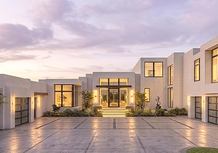 a large, contemporary luxury villa featuring a minimalist architectural style with clean lines and flat roofs