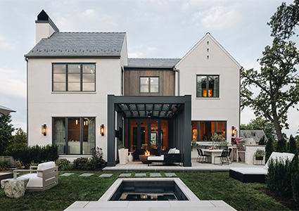 a modern luxury home backyard featuring a plunge pool or small spa