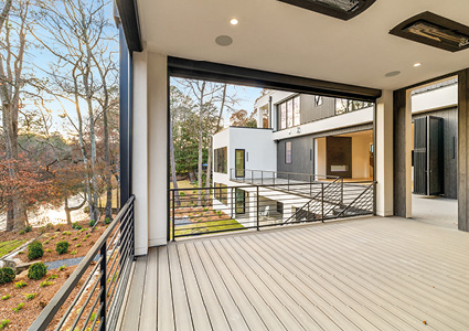 a modern outdoor covered deck or patio area of a contemporary house