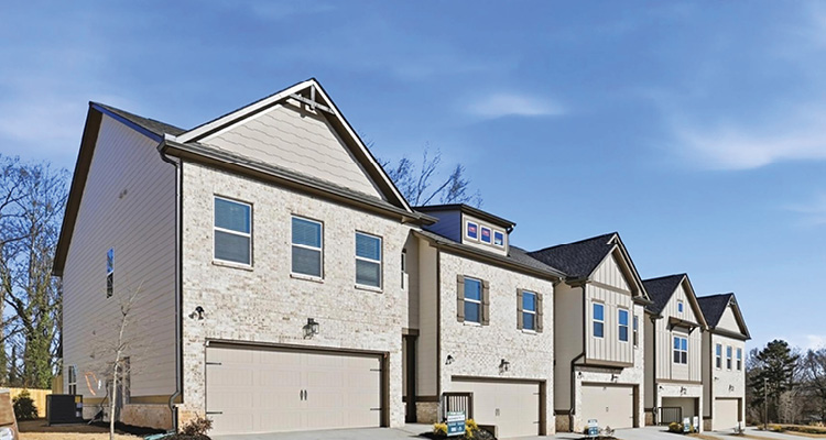 a row of modern suburban townhouses or condominiums