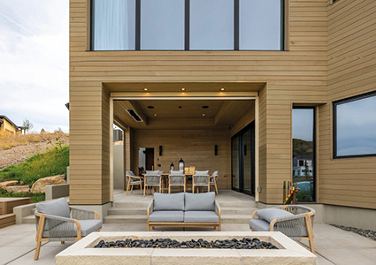 a modern outdoor living space at the back of a contemporary, desert-inspired home.