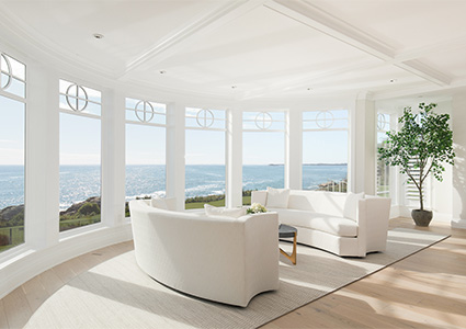 a luxury oceanfront living room located within the historic White Court estate in Swampscott, Massachusetts