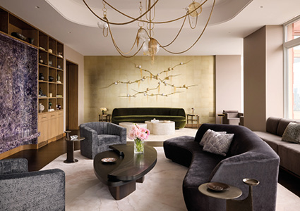 a sophisticated, upscale living room that blends organic shapes with luxurious textures and a rich, moody color palette