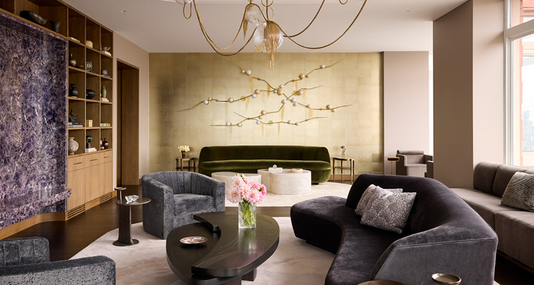 a sophisticated, upscale living room that blends organic shapes with luxurious textures and a rich, moody color palette