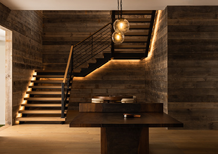  a sophisticated, modern interior featuring a striking staircase as the focal point