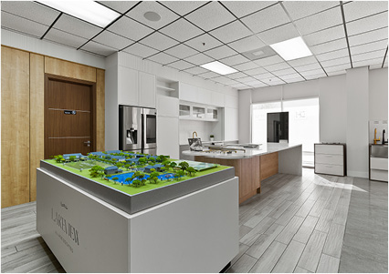 an architectural scale model display stand located inside a contemporary commercial showroom or design studio
