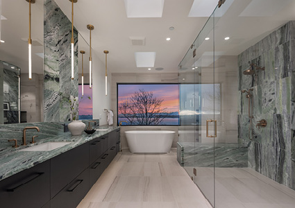 a luxurious modern bathroom featuring dramatic green marble walls, a freestanding tub, and a expansive walk-in shower