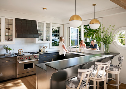 a bright, modern, and open-concept kitchen with an attached breakfast bar