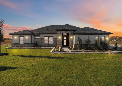 the front exterior of a modern, single-story ranch-style home at dusk