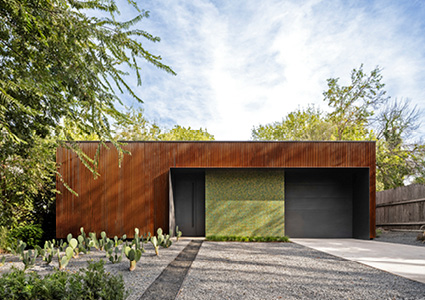 a modern, single-story residential building featuring a minimalist architectural design