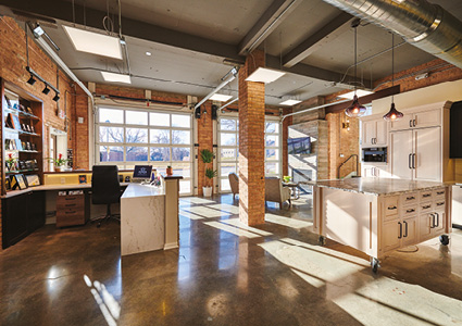 a spacious, modern industrial-style office or studio with an open floor plan