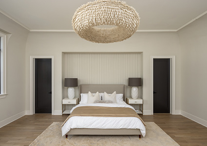 a symmetrical, modern bedroom with a neutral and minimalist color palette