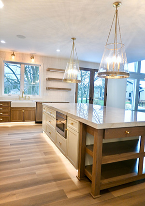 a bright, spacious, and modern kitchen featuring a large central island