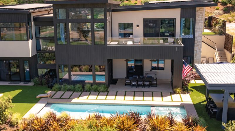 a modern luxury home built on a hillside.