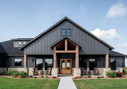 the exterior front view of a large, modern farmhouse-style home
