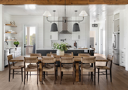 an open-concept kitchen and dining area featuring a modern farmhouse design