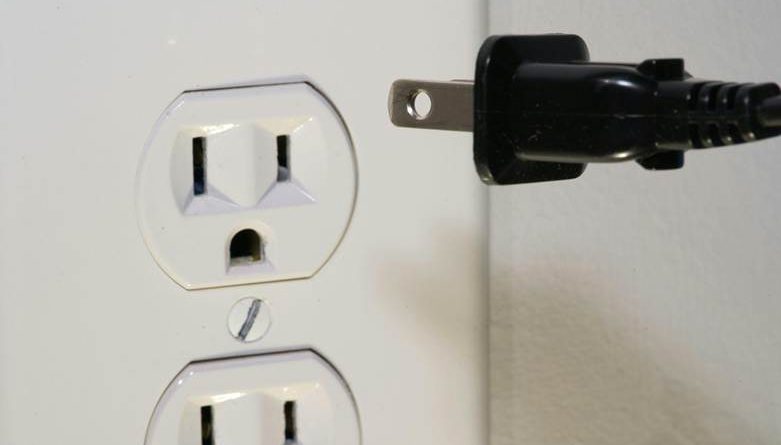 Plug going into electrical socket to support electrical problems article