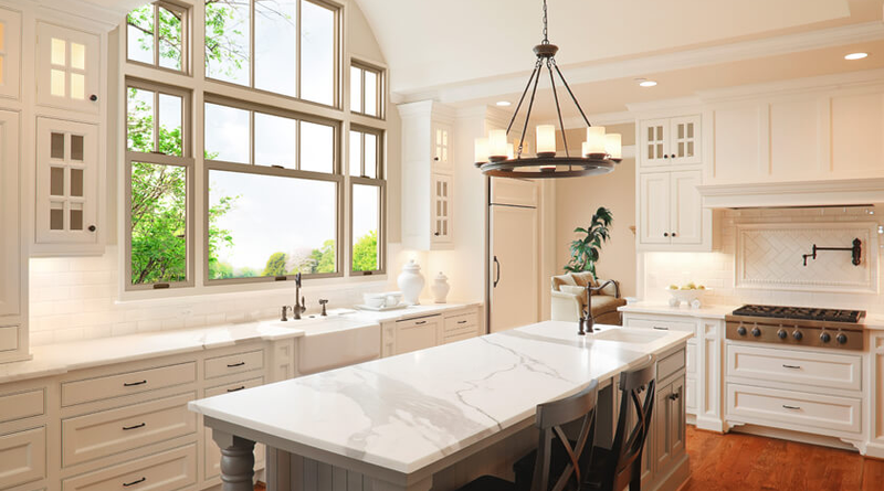 A two-story combination window installation creates a dramatic focal point above the kitchen sink in this Wisconsin home.