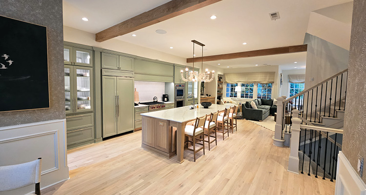 Pine Creek Construction is approaching its 20th anniversary, distinguished by its planning, relationships, and disciplined growth light oak hardwood flooring in a modern, open-concept kitchen and living area
