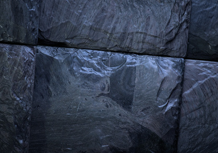 dark, textured stone or slate tiles