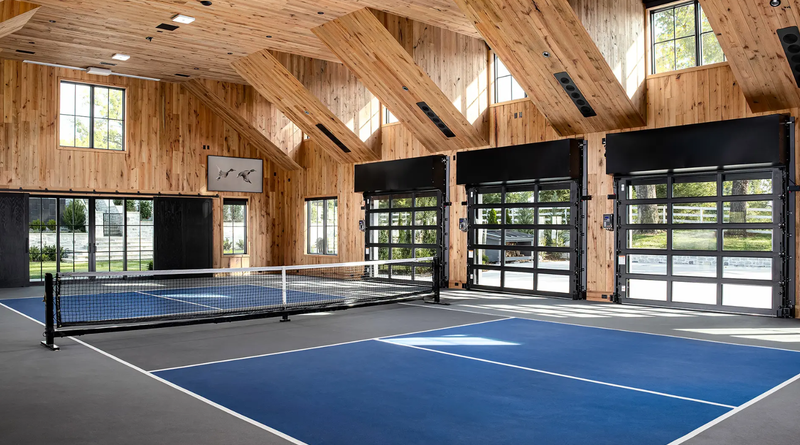 modern garage used for living space and tennis court
