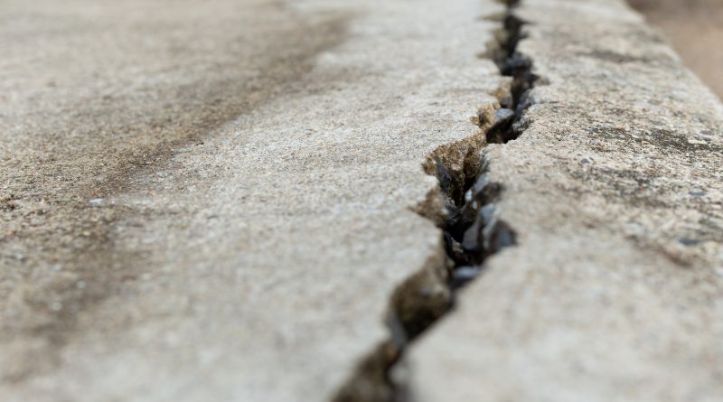cracked concrete on path to support sinking concrete article